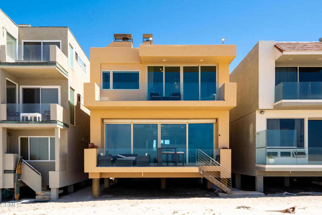 791 Mandalay Beach Road Oxnard, CA 93035 - Photo 43 of 46 a front view of a building with a garden