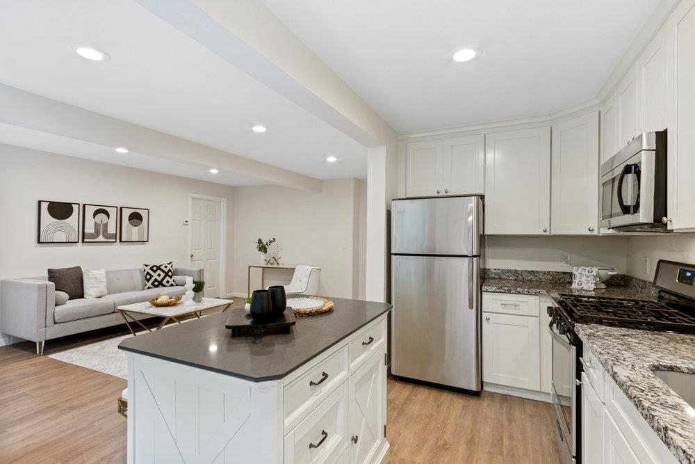 35 Park Way Mount Hermon, CA 95041 - Photo 12 of 46 a kitchen with white cabinets and stainless steel appliances