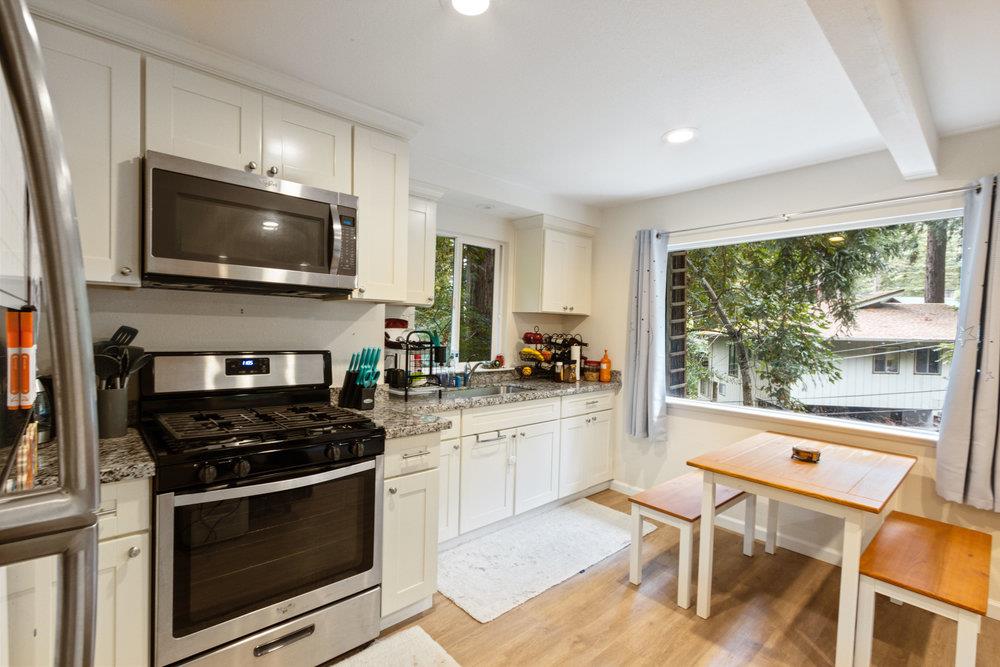 35 Park Way Mount Hermon, CA 95041 - Photo 27 of 46 a kitchen with a stove a sink and a microwave