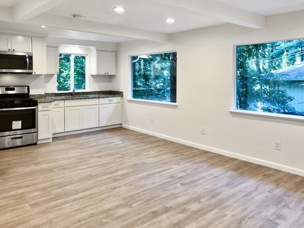 35 Park Way Mount Hermon, CA 95041 - Photo 28 of 46 a kitchen with stainless steel appliances granite countertop a stove a sink and a microwave