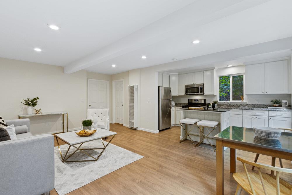 35 Park Way Mount Hermon, CA 95041 - Photo 7 of 46 a living room with stainless steel appliances kitchen island granite countertop a couch and a view of living room