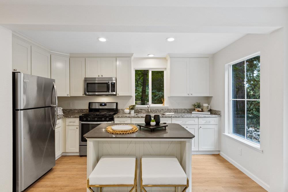 35 Park Way Mount Hermon, CA 95041 - Photo 9 of 46 a kitchen with a refrigerator a stove a sink a window and dining table