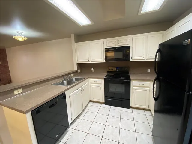 a bathroom with a toilet a sink and shower