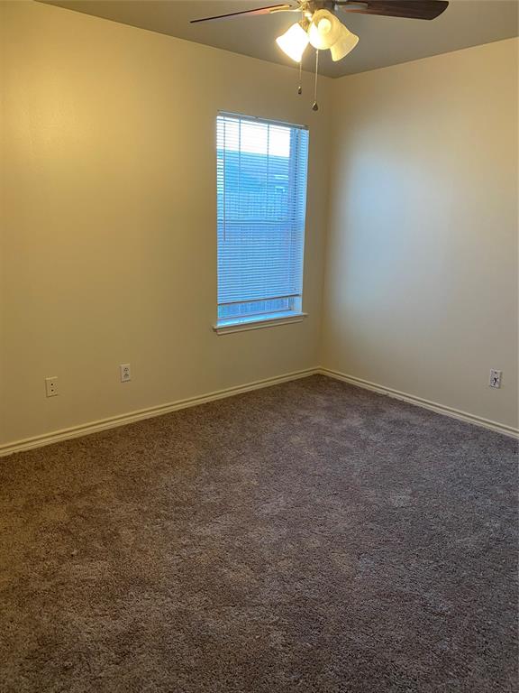 3241 Lexington Drive Tyler, TX 75701 - Photo 17 of 17 a view of an empty room and chandelier fan