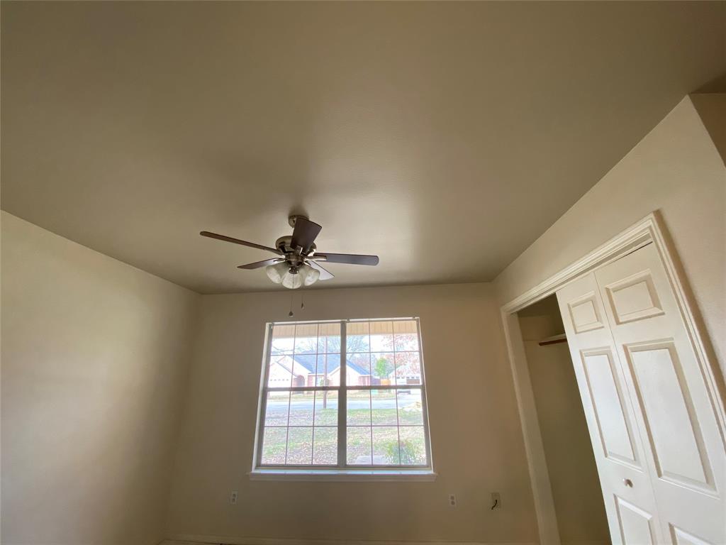 3241 Lexington Drive Tyler, TX 75701 - Photo 5 of 17 a view of a livingroom with a ceiling fan and window