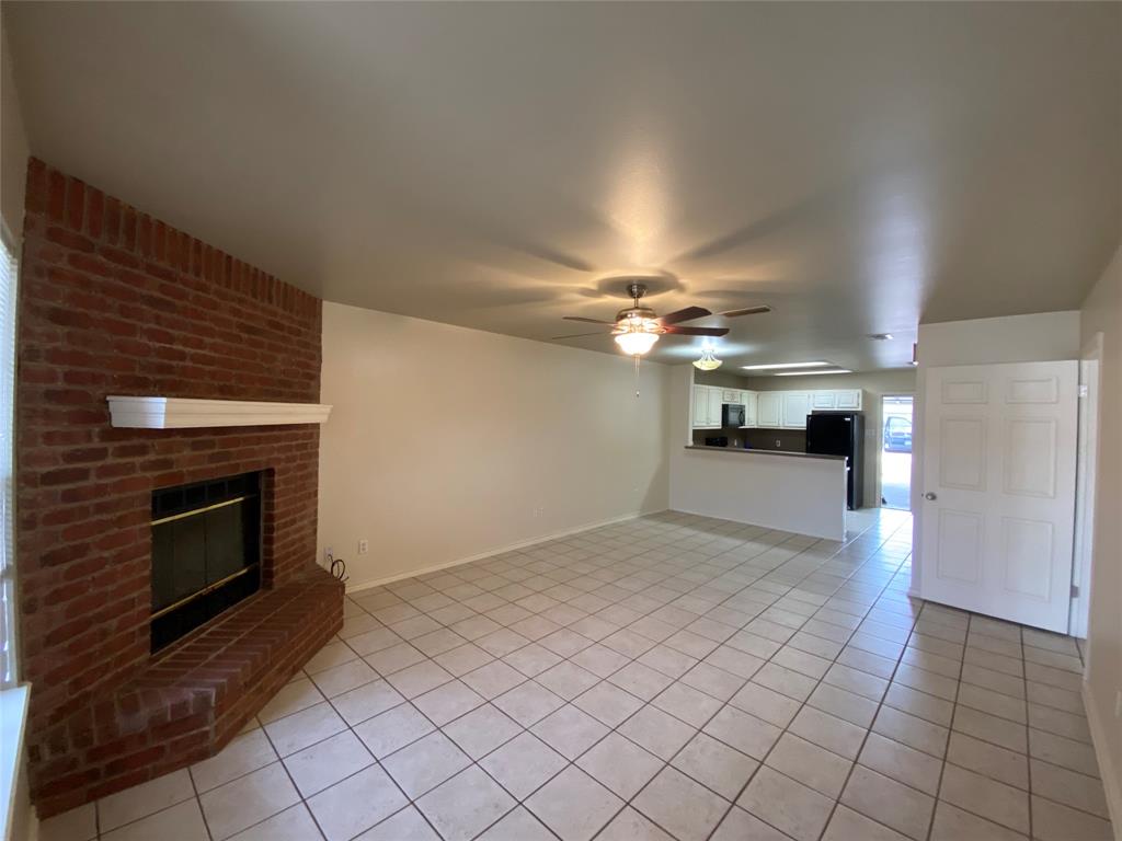 3241 Lexington Drive Tyler, TX 75701 - Photo 8 of 17 a view of empty room with fireplace and fan