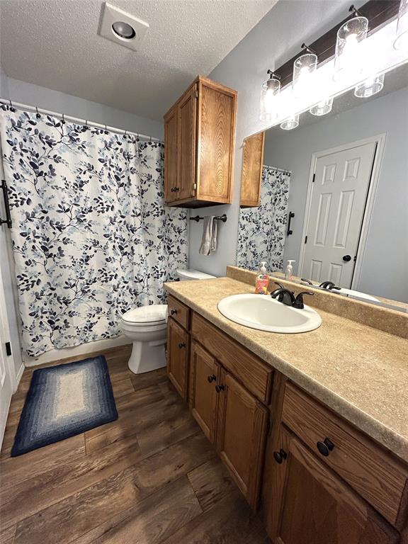 1974 County Road Powderly, TX 75473 - Photo 15 of 33 a bathroom with a sink and a mirror