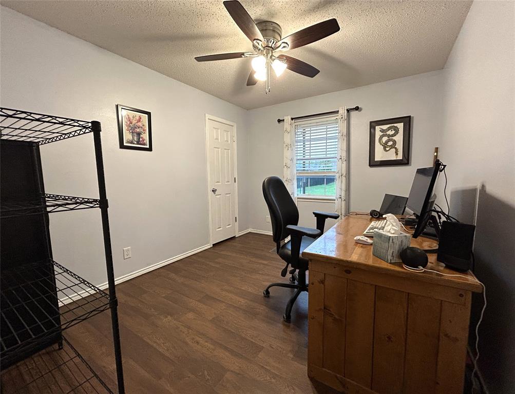 1974 County Road Powderly, TX 75473 - Photo 17 of 33 a view of a workspace with furniture and a window