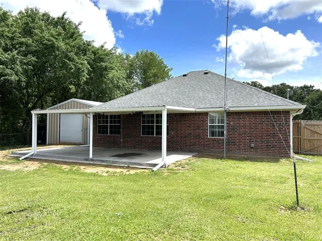 a house with trees in the background