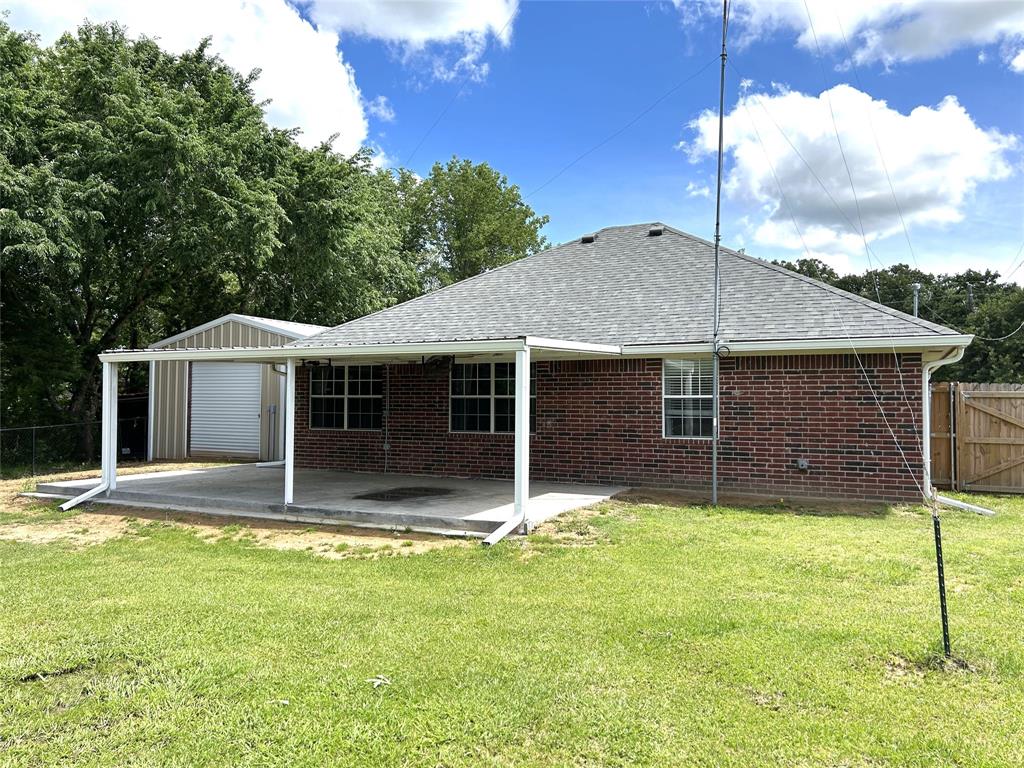 1974 County Road Powderly, TX 75473 - Photo 30 of 33 a house with trees in the background