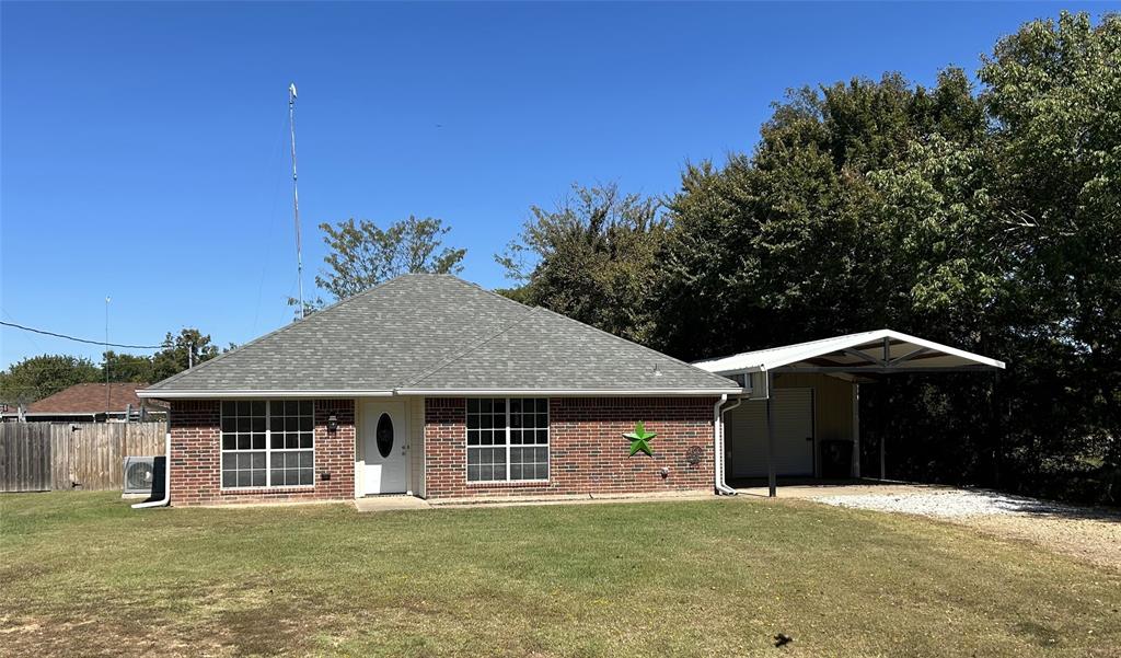 1974 County Road Powderly, TX 75473 - Photo 31 of 33 a front view of a house with a yard