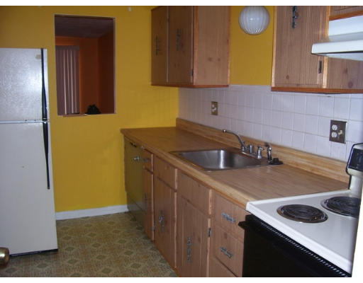 33 Cary Avenue, Unit 11 Chelsea, MA 02150 - Photo 2 of 7 a kitchen with a sink and a refrigerator
