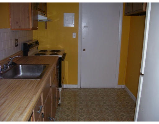 33 Cary Avenue, Unit 11 Chelsea, MA 02150 - Photo 3 of 7 a kitchen with a sink and cabinets
