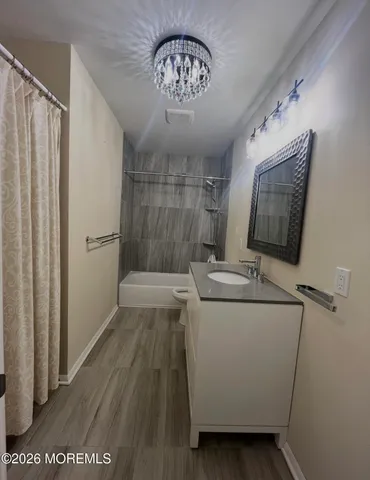 a view of a hallway with washer and dryer