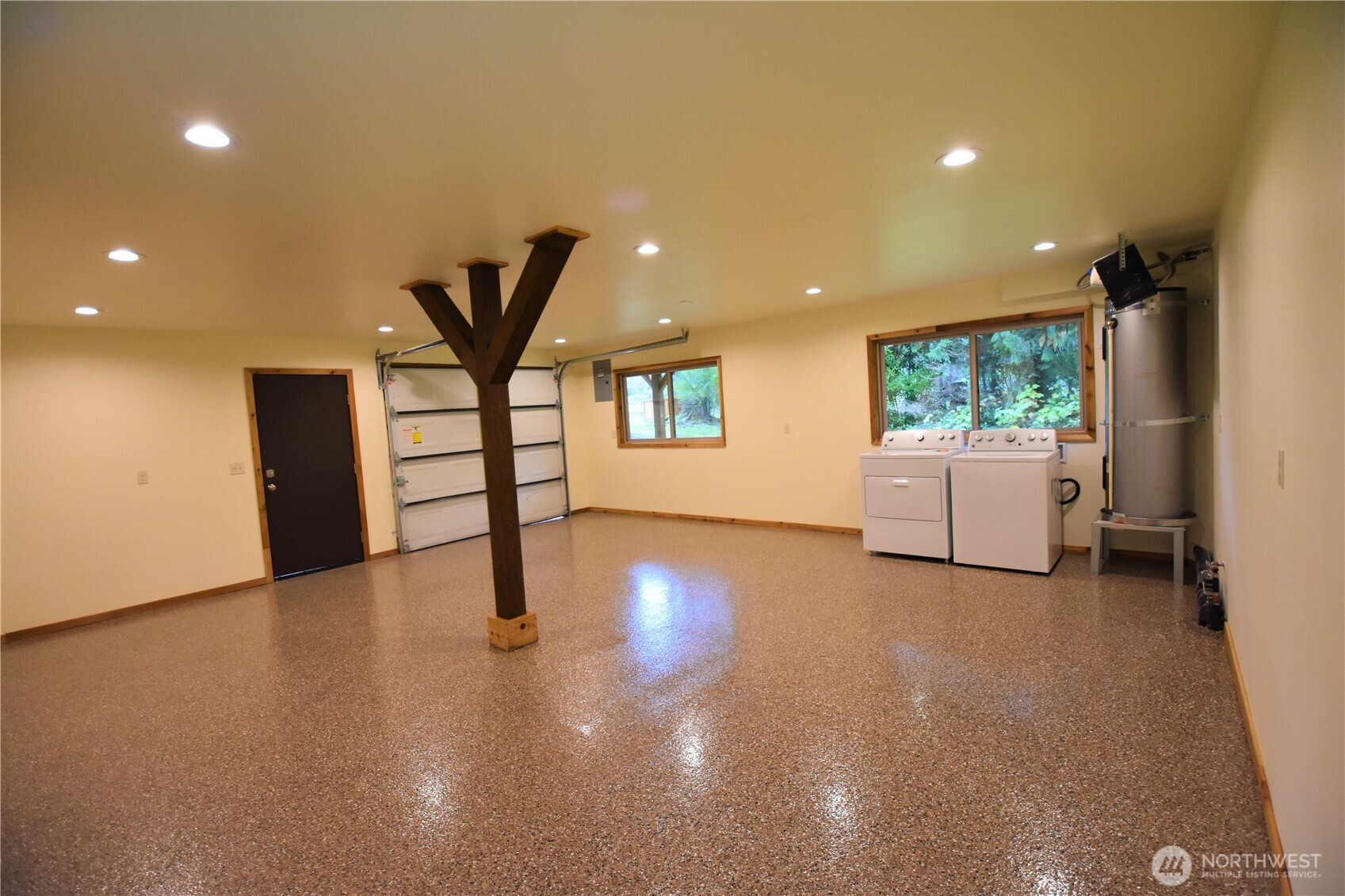 30331 Heimer Road Arlington, WA 98223 - Photo 33 of 37 a view of a livingroom with furniture a ceiling fan and window