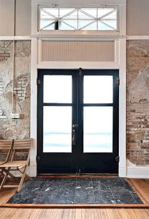 a view of entryway with wooden floor