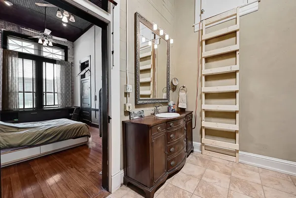 a view of bedroom with a large bed and a dresser