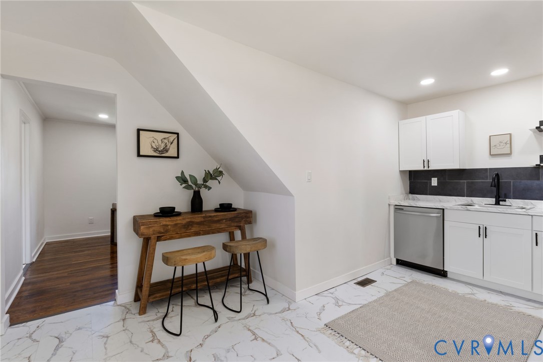 1815 Doron Lane Richmond, VA 23223 - Photo 12 of 26 a living room with furniture a dining table and a stove top oven