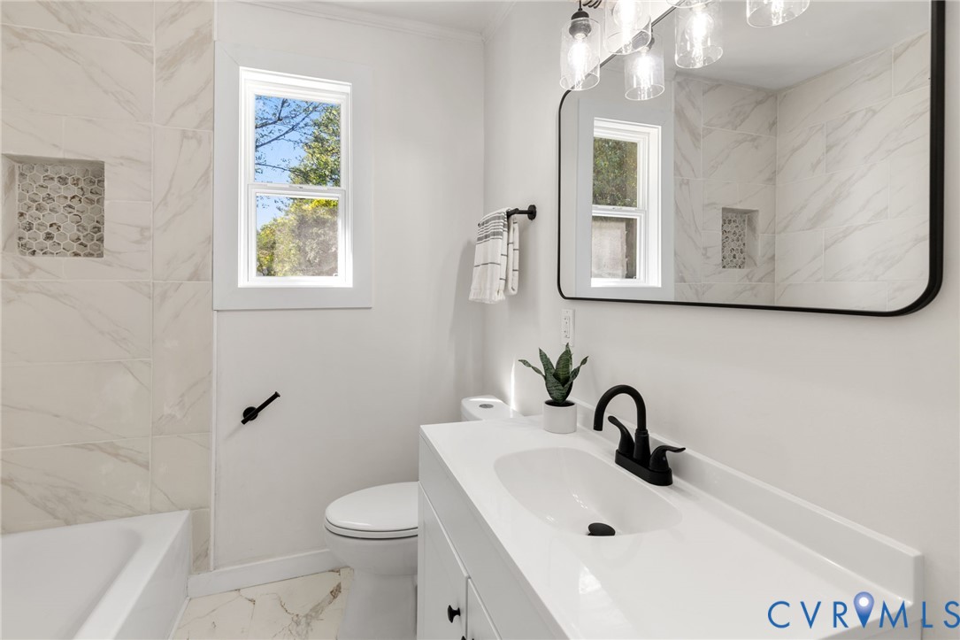 1815 Doron Lane Richmond, VA 23223 - Photo 13 of 26 a bathroom with a sink mirror and toilet