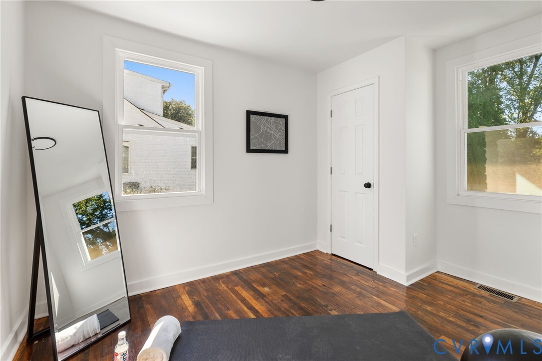 1815 Doron Lane Richmond, VA 23223 - Photo 14 of 26 a bedroom with a bed and a window