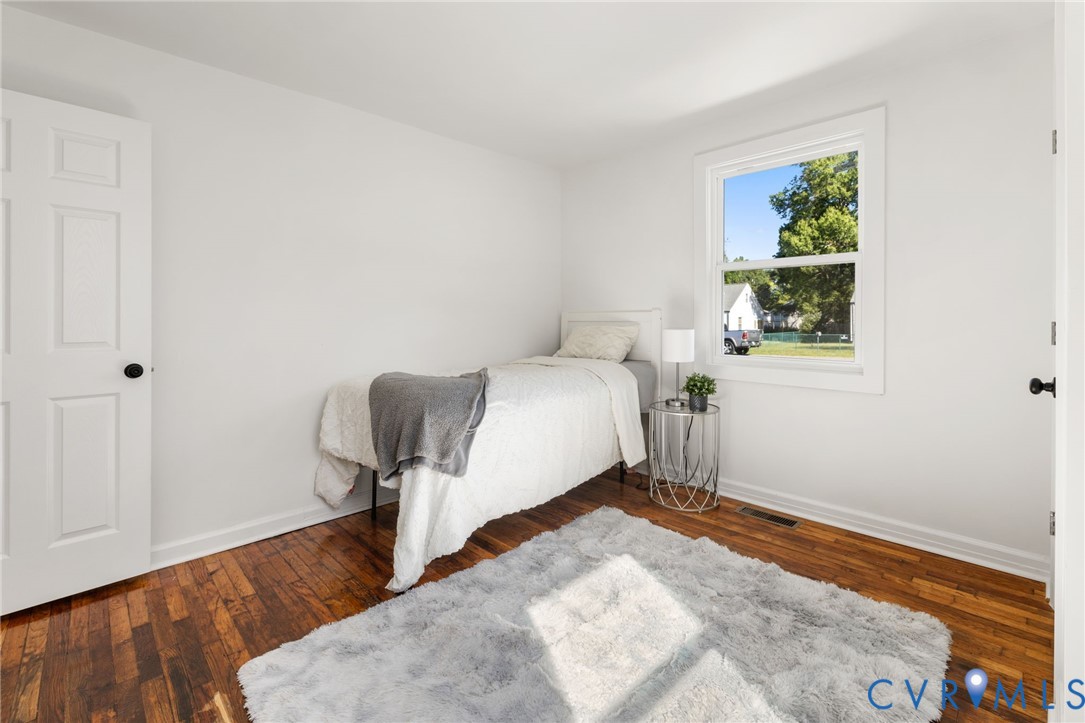 1815 Doron Lane Richmond, VA 23223 - Photo 16 of 26 a bedroom with a bed and a window