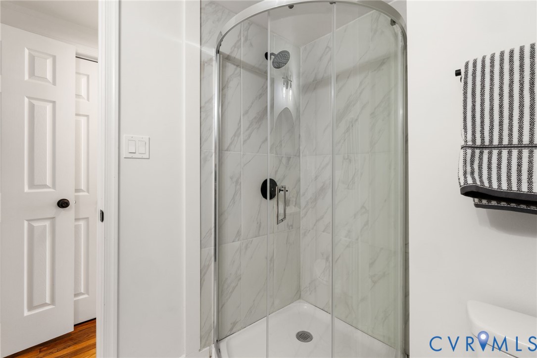 1815 Doron Lane Richmond, VA 23223 - Photo 21 of 26 a bathroom with a glass shower door