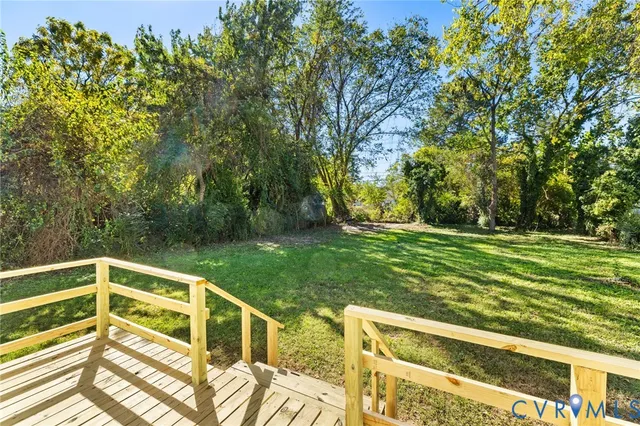 a view of a yard with a large trees