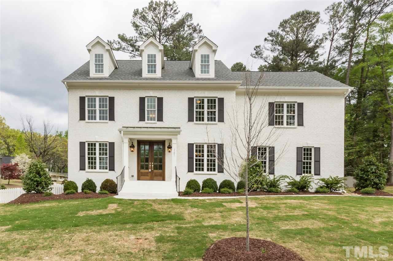 3201 Plantation Road Raleigh, NC 27609 - Photo 1 of 25 a front view of a house with a yard
