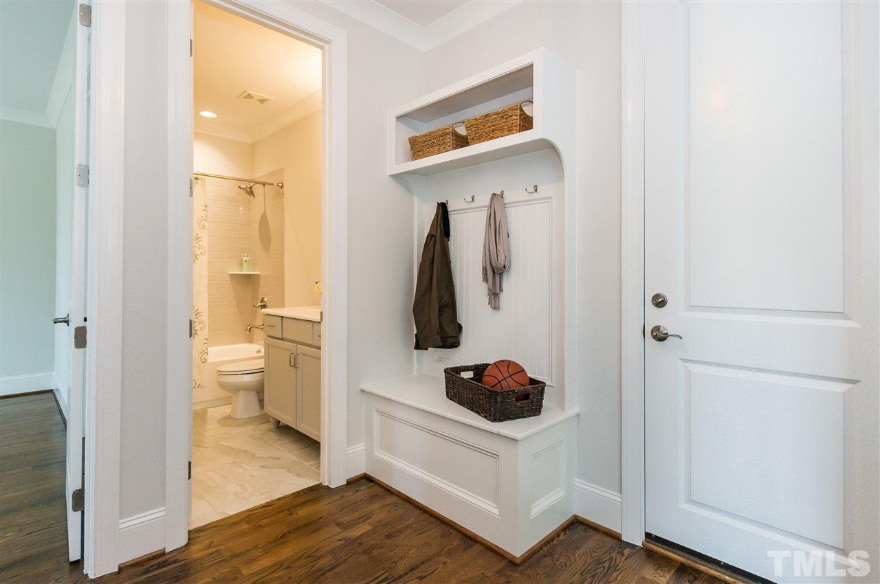 3201 Plantation Road Raleigh, NC 27609 - Photo 11 of 25 a view of a closet and a living room