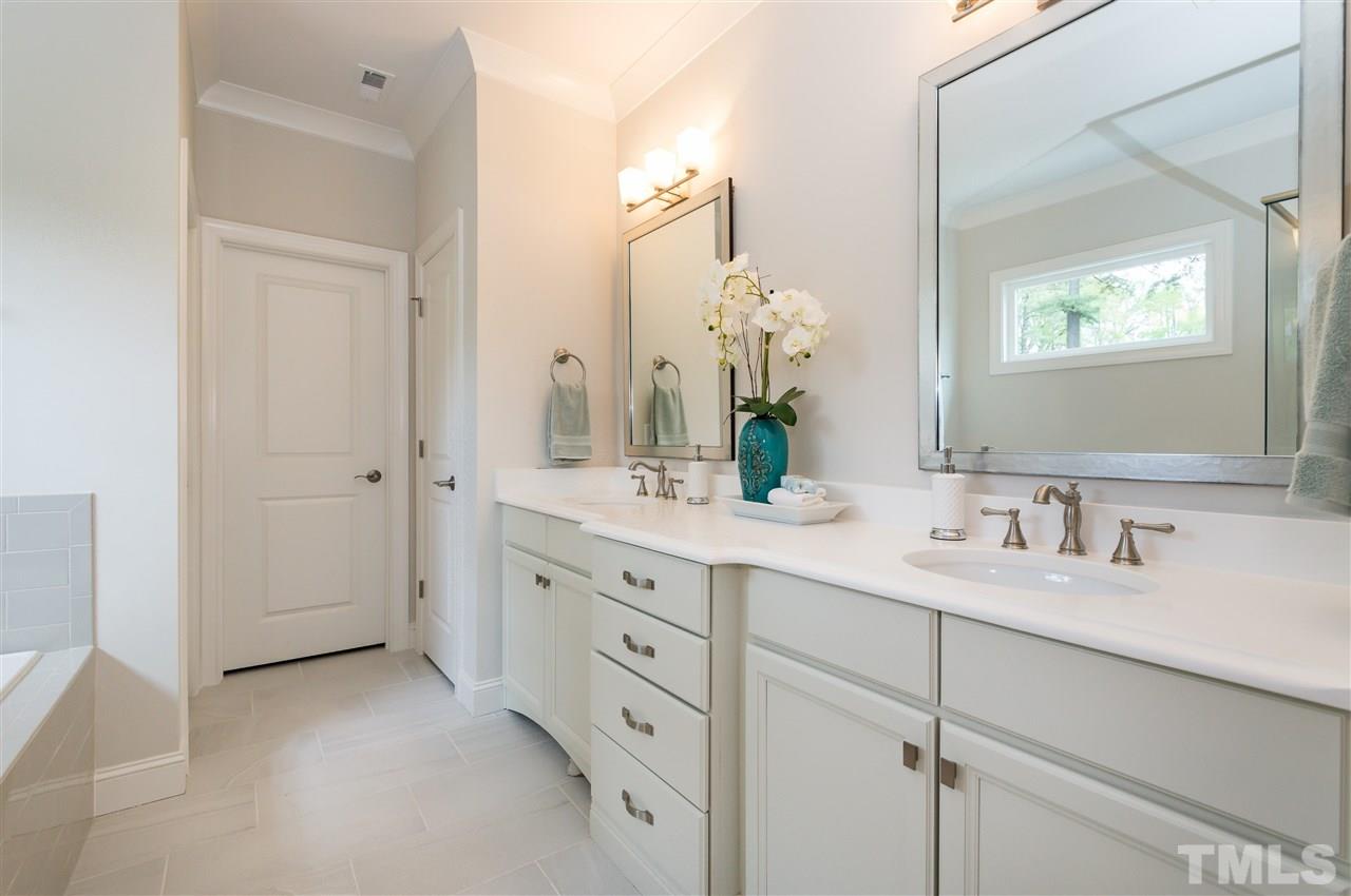 3201 Plantation Road Raleigh, NC 27609 - Photo 14 of 25 a bathroom with a granite countertop sink mirror and a