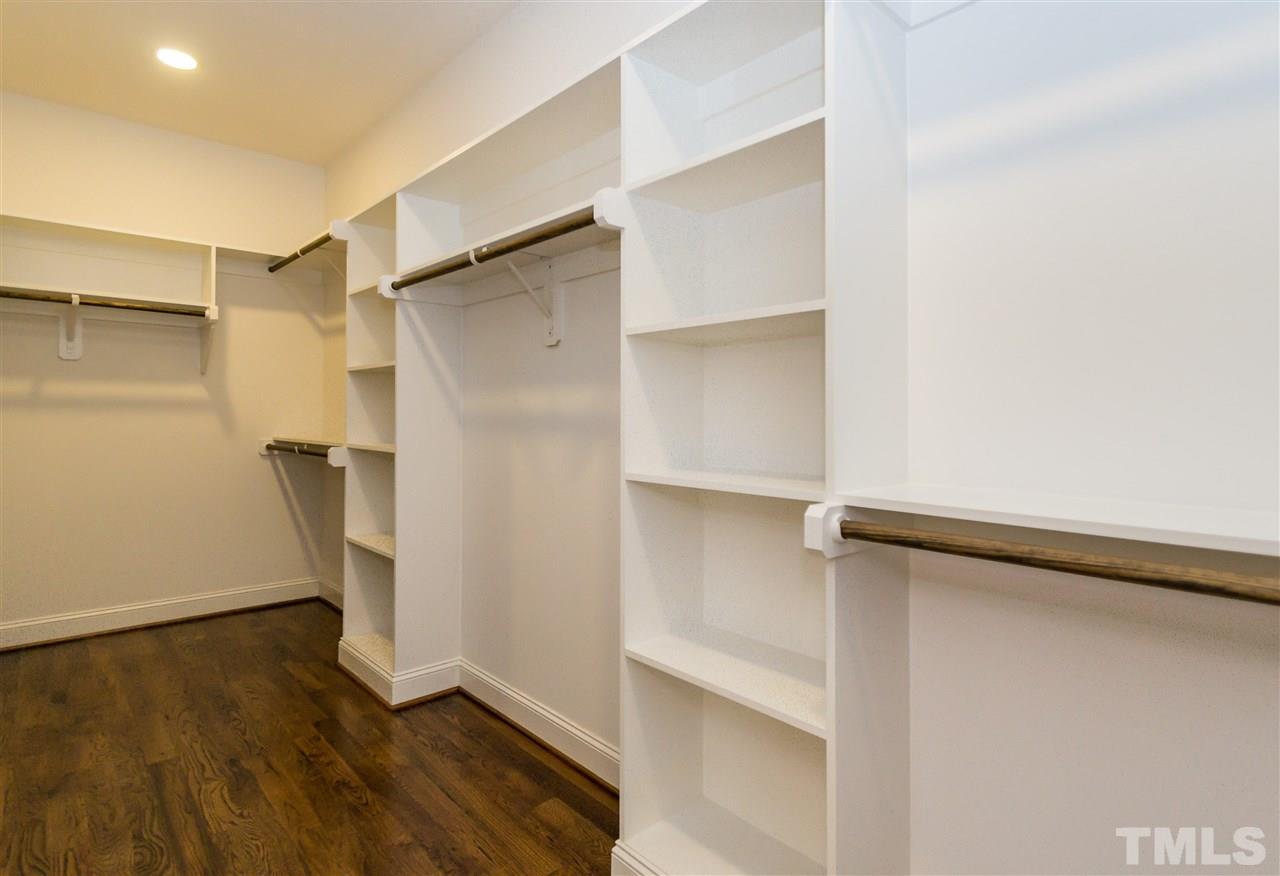 3201 Plantation Road Raleigh, NC 27609 - Photo 15 of 25 a view of walk in closet with empty racks