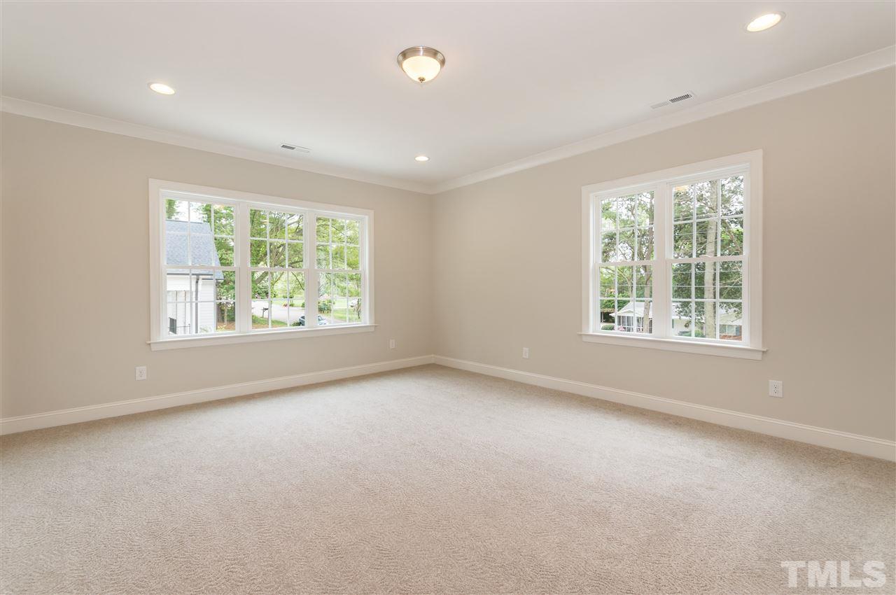 3201 Plantation Road Raleigh, NC 27609 - Photo 17 of 25 an empty room with windows