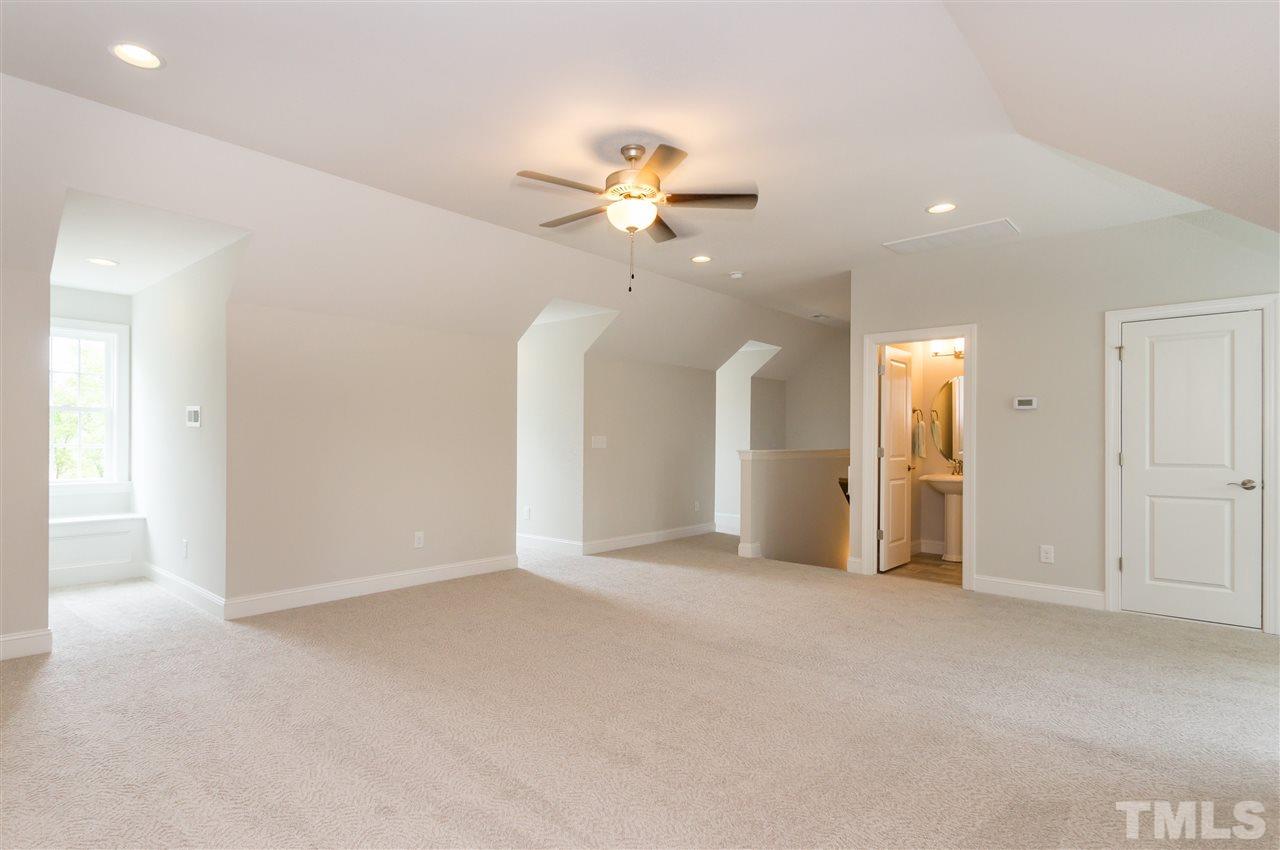 3201 Plantation Road Raleigh, NC 27609 - Photo 21 of 25 a view of an empty room with a ceiling fan