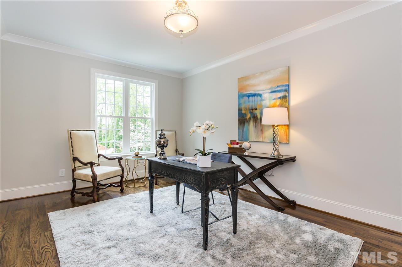 3201 Plantation Road Raleigh, NC 27609 - Photo 4 of 25 a view of a workspace room with furniture and a window