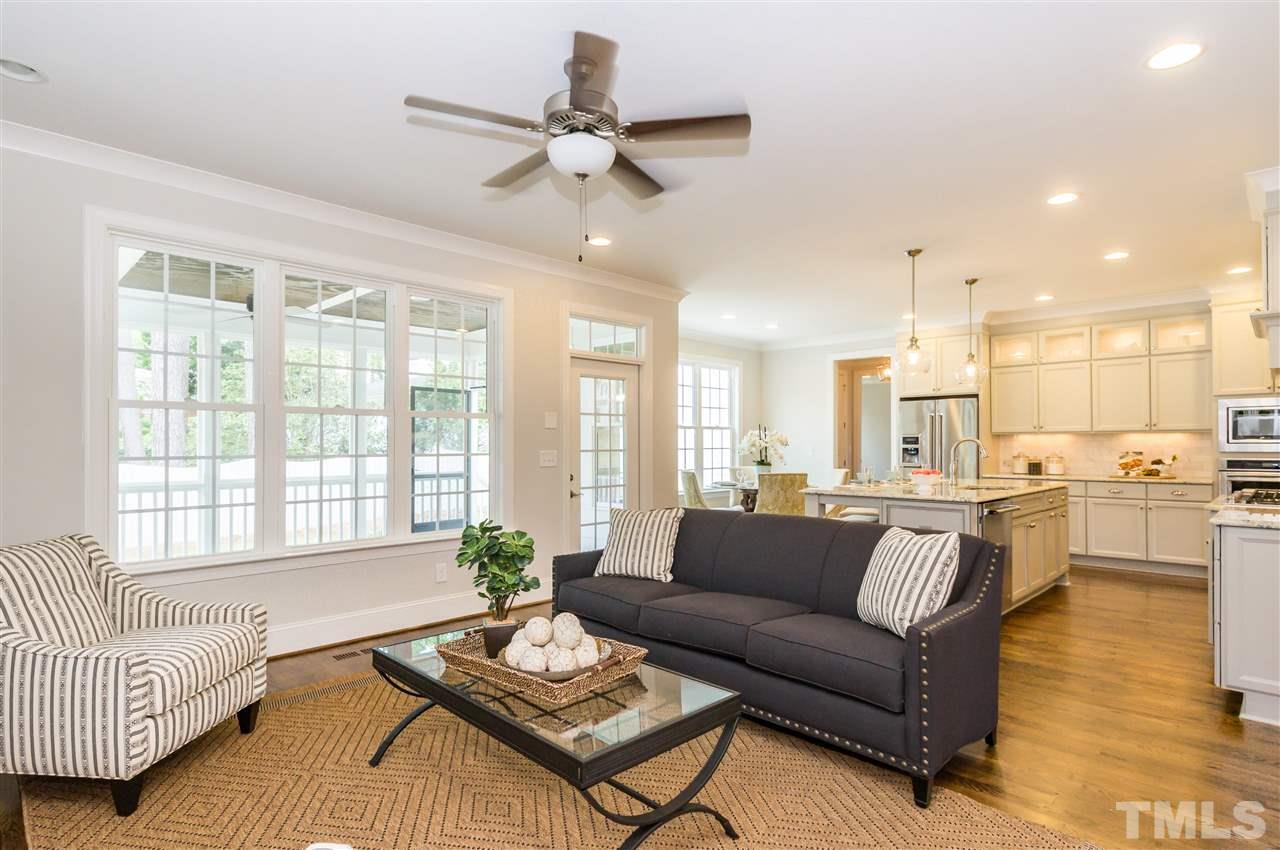 3201 Plantation Road Raleigh, NC 27609 - Photo 7 of 25 a living room with furniture and a large window