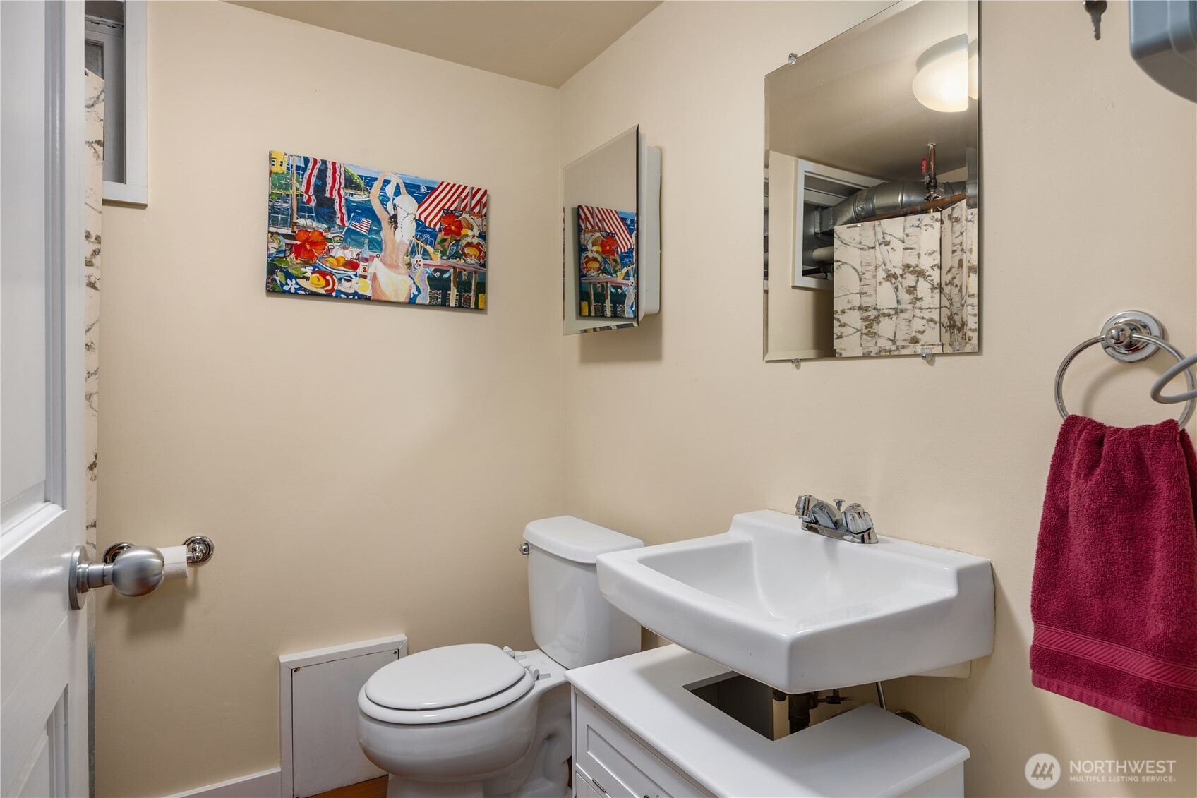 525 West Prospect Street, Unit A Seattle, WA 98119 - Photo 22 of 33 a bathroom with a sink mirror and toilet