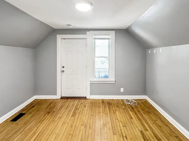 a view of a balcony with wooden floor