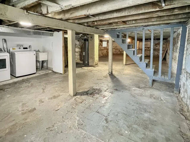 a view of a house with a yard and deck