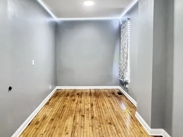 a view of bathroom with wooden floor