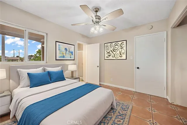 a bedroom with a large bed and a window