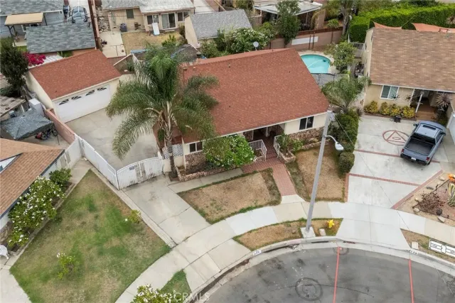 an aerial view of a house with outdoor space