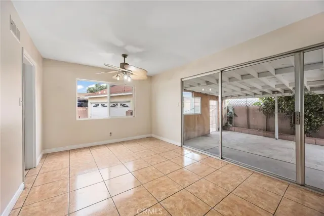 a view of an empty room and glass door