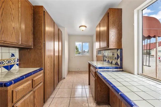 a kitchen with stainless steel appliances granite countertop a stove and a refrigerator