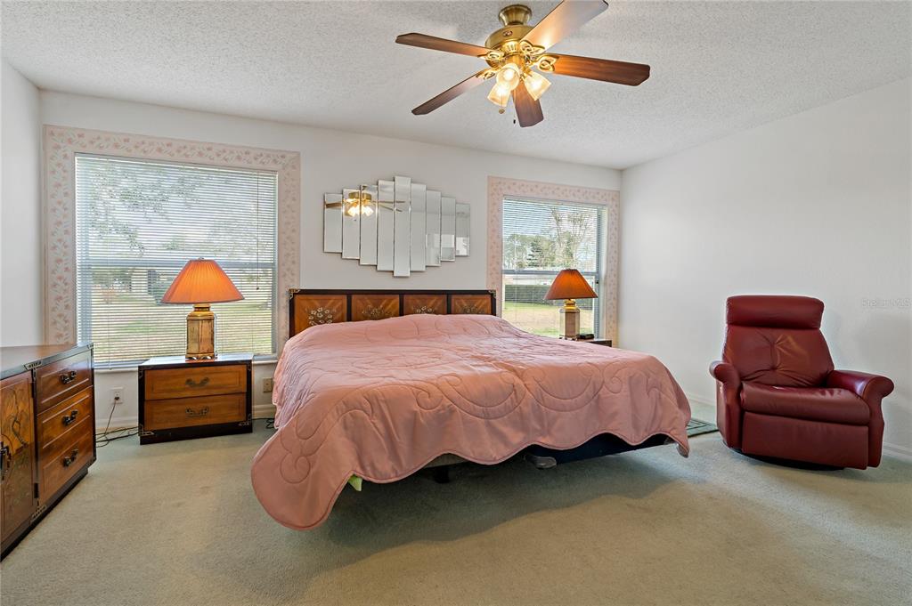 11744 Wheatfield Loop Hudson, FL 34667 - Photo 16 of 48 Primary Bedroom