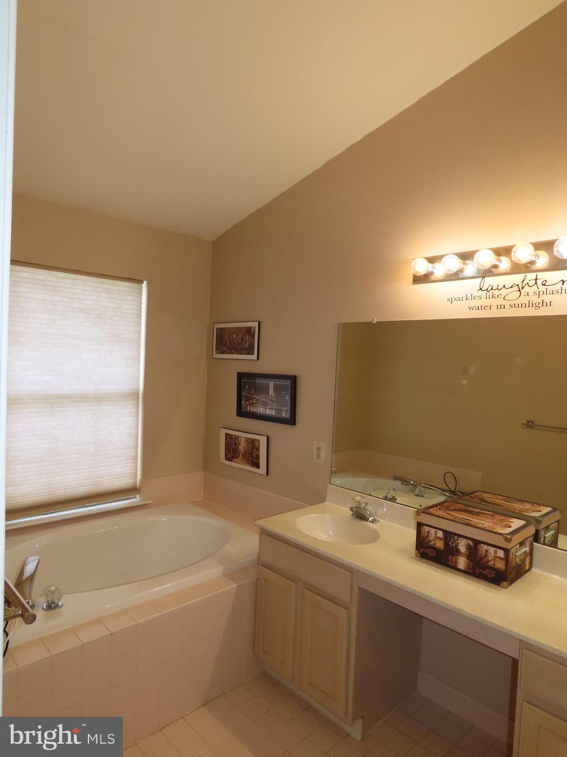 1903 Waterford Road, Unit 34 Yardley, PA 19067 - Photo 11 of 14 a bathroom with a sink a toilet and a bathtub