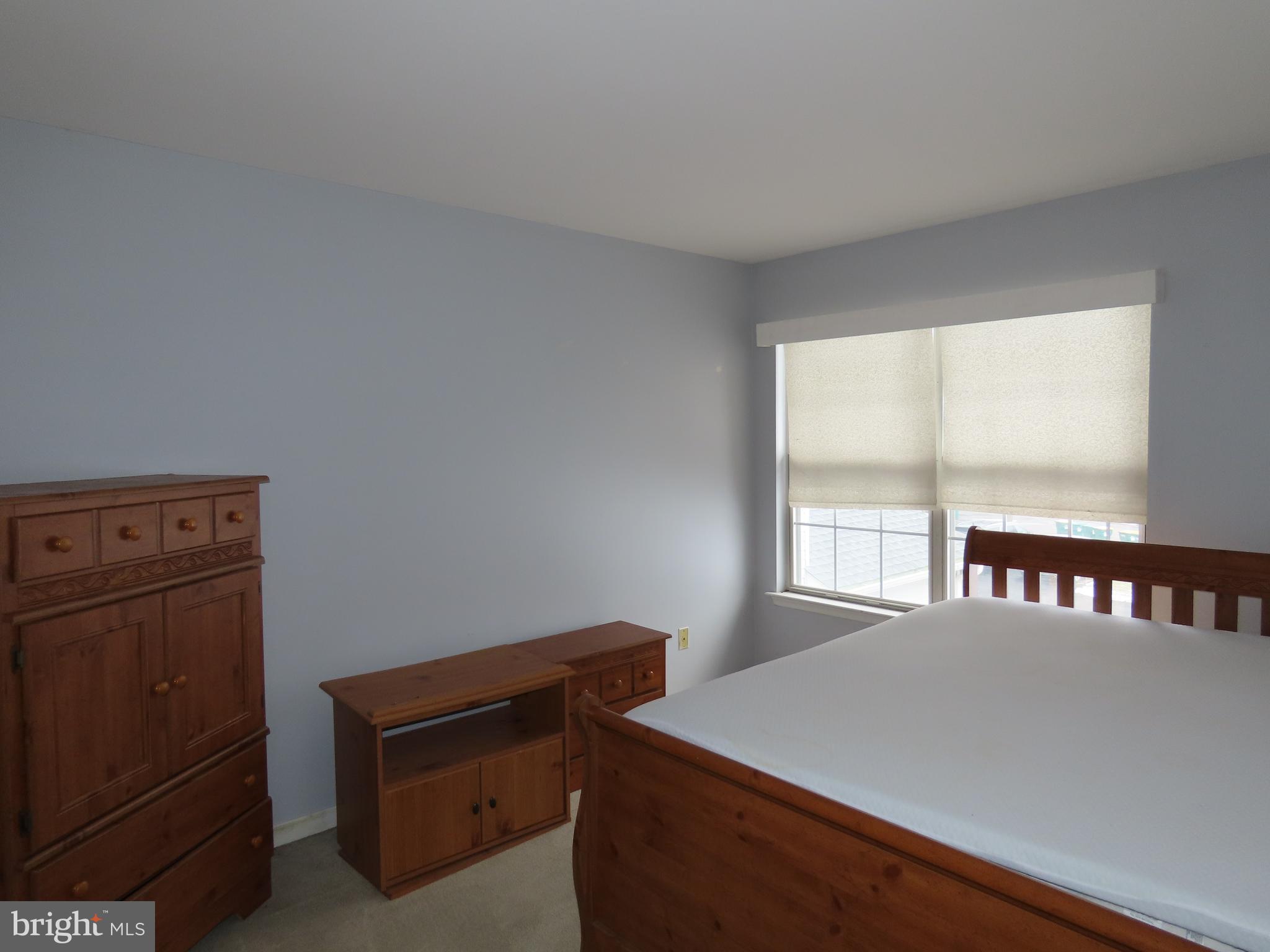 1903 Waterford Road, Unit 34 Yardley, PA 19067 - Photo 12 of 14 a room with a bed and a window