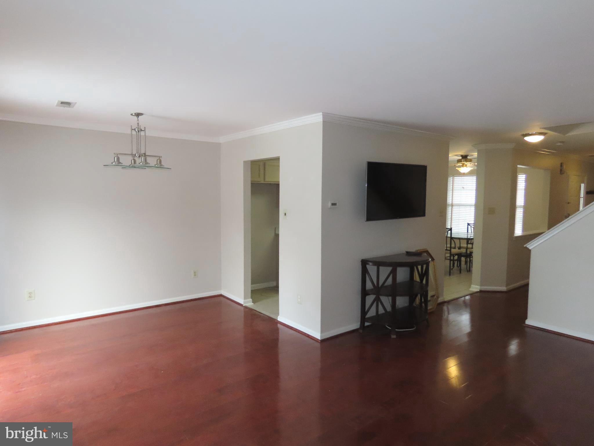 1903 Waterford Road, Unit 34 Yardley, PA 19067 - Photo 4 of 14 a view of a livingroom with furniture wooden floor and a flat screen tv
