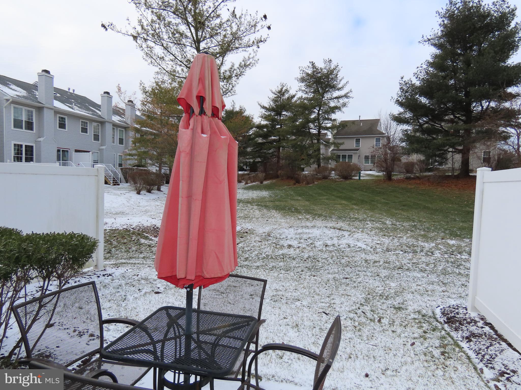 1903 Waterford Road, Unit 34 Yardley, PA 19067 - Photo 6 of 14 a view of a backyard with furniture and a garden