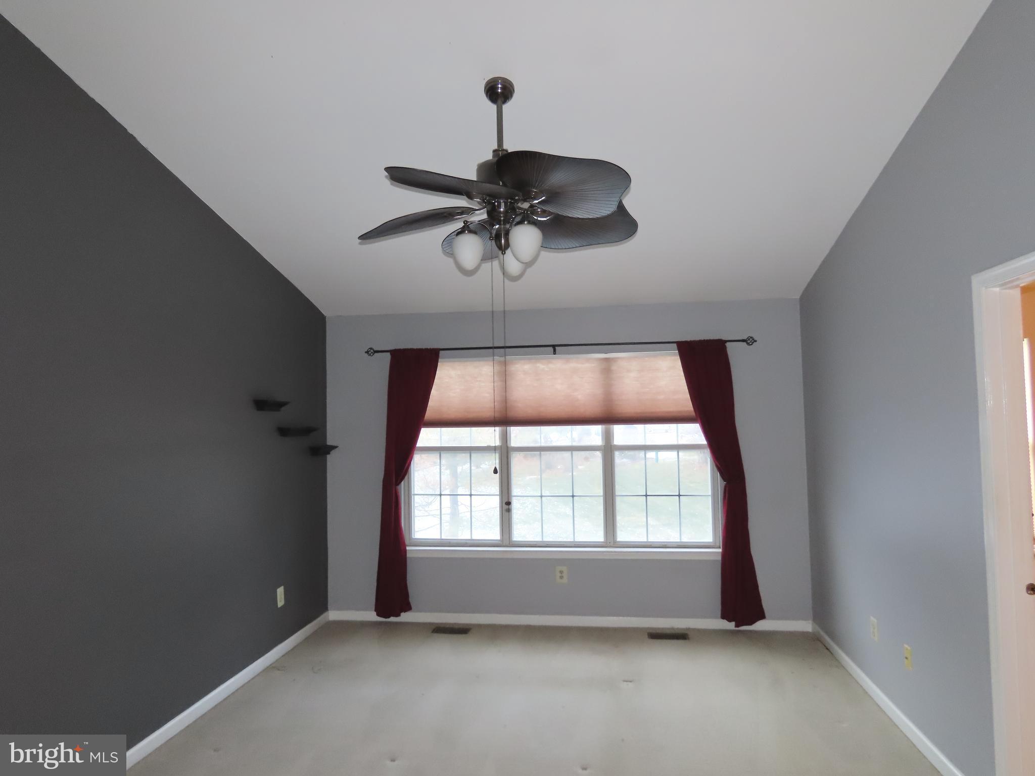 1903 Waterford Road, Unit 34 Yardley, PA 19067 - Photo 9 of 14 a view of an empty room with a window