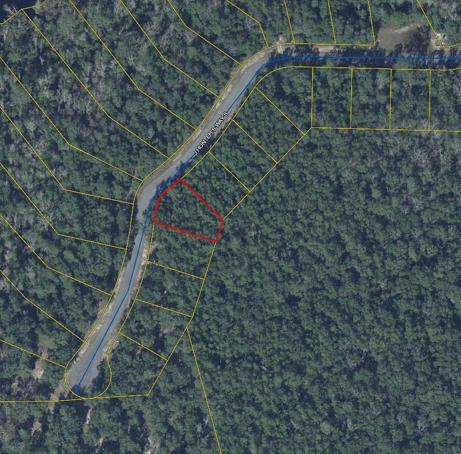 a bird view of a house with a yard